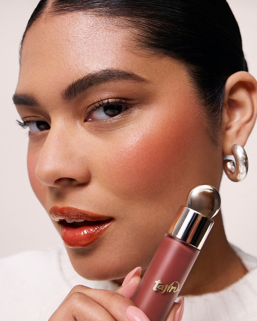 Model applying blush